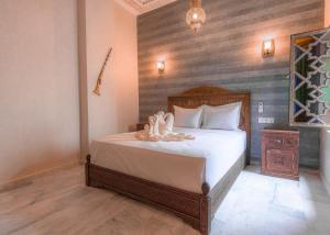 Postel nebo postele na pokoji v ubytování Riad Deluxe