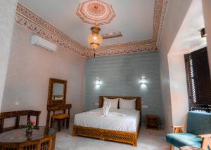 Postel nebo postele na pokoji v ubytování Riad Deluxe