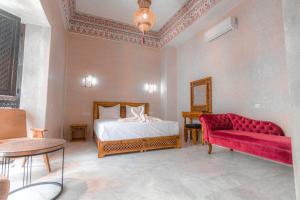 Postel nebo postele na pokoji v ubytování Riad Deluxe