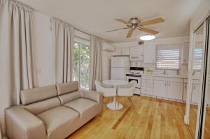 a living room with a couch and a table at Gulside Resort. Unit 8 in St. Pete Beach