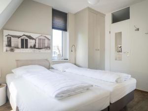 Ένα ή περισσότερα κρεβάτια σε δωμάτιο στο Apartment in Netherlands near the Beach
