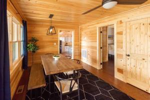 a wooden room with a wooden table and a ceiling at Family Cabin Near Smoky Mtn Entrance Nantahala in Robbinsville