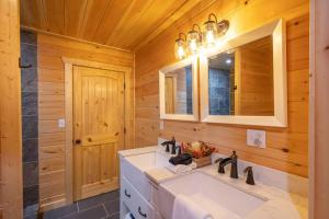 a bathroom with a sink and a mirror at Family Cabin Near Smoky Mtn Entrance Nantahala in Robbinsville