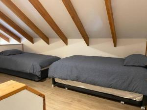 Posteľ alebo postele v izbe v ubytovaní The Cabins, Malalcahuello