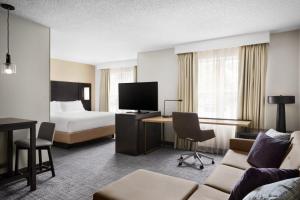 a hotel room with a bed and a desk at Residence Inn by Marriott Philadelphia Langhorne in Langhorne