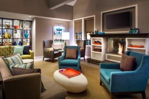 a living room with a fireplace and a tv at Residence Inn Los Angeles Torrance/Redondo Beach in Torrance
