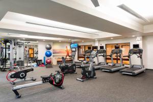 a gym with a lot of treadmills and machines at Courtyard by Marriott Livermore in Livermore