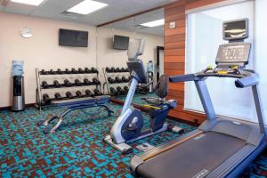 a gym with two treadmills and exercise bikes at Fairfield Inn & Suites by Marriott Alamosa in Alamosa