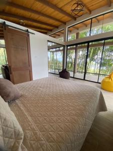 A bed or beds in a room at Zen Oasis del Bosque, second floor!