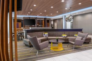 a lobby with a couch and chairs and a table at SpringHill Suites by Marriott Riverside Redlands in Redlands