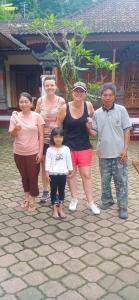 a group of people posing for a picture at Rindu Homestay in Undisan