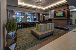 a hotel lobby with a dining room and a bar at Residence Inn Norfolk Downtown in Norfolk
