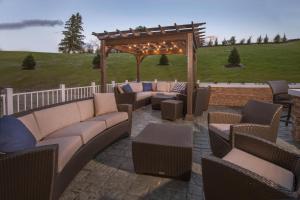 a patio with couches and a gazebo at TownePlace Suites by Marriott Altoona in Altoona