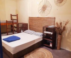 Una cama o camas en una habitación de Casinha Guiné MorroSP