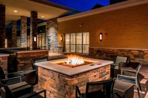 a fire pit in the middle of a patio at Residence Inn by Marriott Fishkill in Fishkill