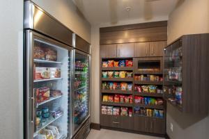 a kitchen with an open refrigerator and lots of food at Residence Inn by Marriott Columbus Polaris in Columbus