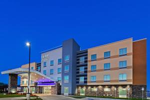 a hotel building with a street light in front of it at Fairfield Inn & Suites by Marriott Liberal in Liberal