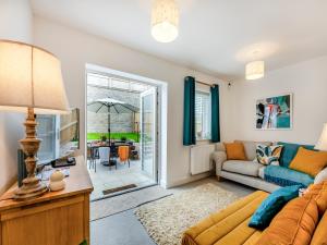 a living room with a couch and a table at Phoenix House in Kingsbridge