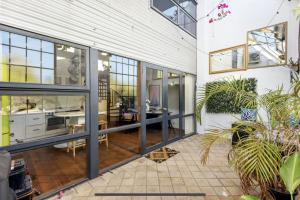 a large house with a dining room and a living room at 5 North Freo 2br Supercool Pad & Parking in North Fremantle