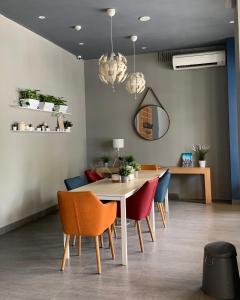 a dining room with a table and chairs at PassGo Thamrin in Jakarta