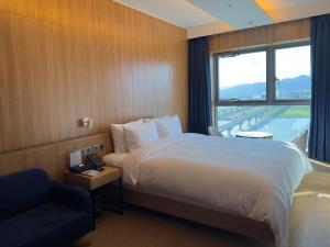 Postel nebo postele na pokoji v ubytování Hotel tt Gupo