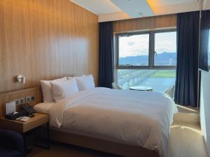 Postel nebo postele na pokoji v ubytování Hotel tt Gupo
