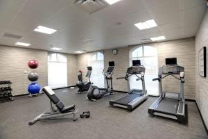 a gym with several exercise equipment in a room at Courtyard by Marriott Columbus OSU in Columbus