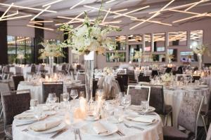 a banquet hall with white tables and chairs at Courtyard by Marriott Columbus OSU in Columbus