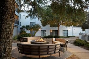 a fire pit in the courtyard of a building at Courtyard by Marriott- Austin Round Rock in Round Rock