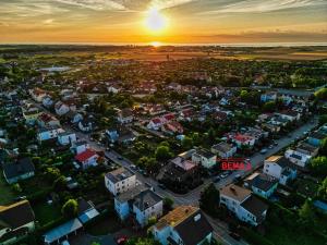 an aerial view of a city at sunset at Bema 3 Darłowo in Darłowo