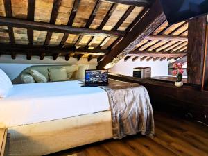a bedroom with a bed with a laptop on it at Smart Lodging Prime in Rome