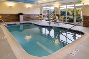 a large swimming pool in a hotel room at Fairfield Inn & Suites by Marriott Plymouth White Mountains in Plymouth