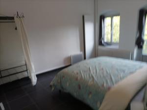 a bedroom with a bed and a window at O'Couvent - Appartement 441 - 3 chambres - 97 m2 - Quatrième étage in Salins-les-Bains
