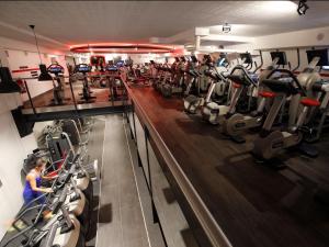 a gym with a bunch of cardio equipment in it at T2 Prado Plage / Vélodrome in Marseille