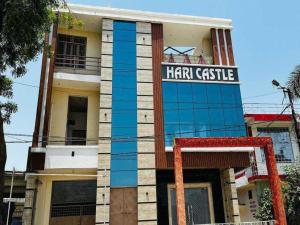 a building with a sign that reads hair castle at OYO Flagship Hari Castle in Kānpur