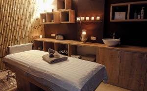 a room with a bed and a sink and a counter at New Gudauri Apartment #407 in Gudauri