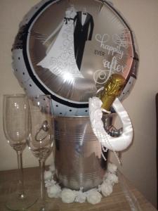 a bucket with a bottle of champagne and two wine glasses at JustB in Riemst