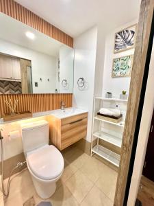 a bathroom with a toilet and a sink at Stanford Suites 3 in Silang