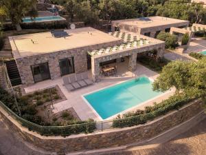 an aerial view of a house with a swimming pool at Ouzo Stone House 2 with private pool in Plomari