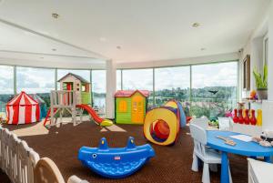 a play room with many different types of play equipment at Hotel Artur in Kraków