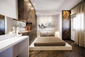 A bed or beds in a room at Privée Santorini