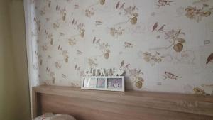 a bedroom with a wall with drawings of butterflies at Regim hotelier Alba Iulia AmOS in Alba Iulia +2 photos