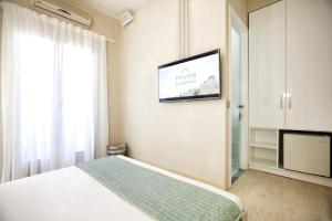 A bed or beds in a room at Privée Santorini