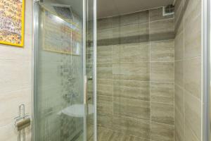 a shower with a glass door in a bathroom at Stylish in Istanbul
