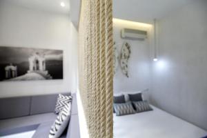 A bed or beds in a room at Privée Santorini
