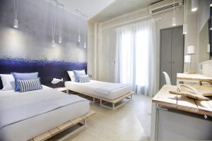 A bed or beds in a room at Privée Santorini