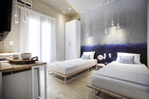 A bed or beds in a room at Privée Santorini
