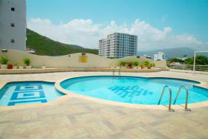 a large swimming pool on top of a building at Apartamento 802 Brisas marinas Santa Marta COLOMBIA in Santa Marta
