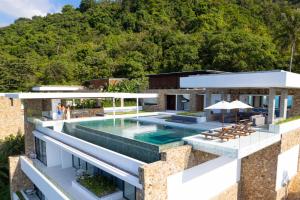 an aerial view of a house with a swimming pool at Villa Blue View Luxe in Mae Nam