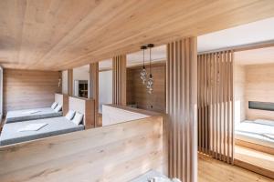 A bed or beds in a room at Lech Valley Lodge